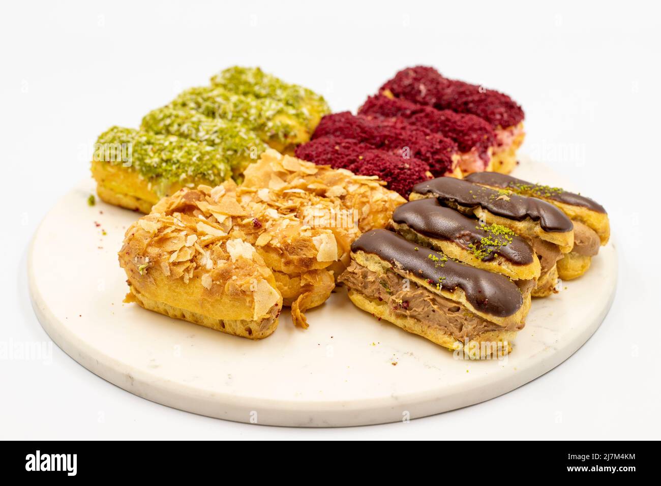 Eclair cake. Assortment of eclairs cake on a white background