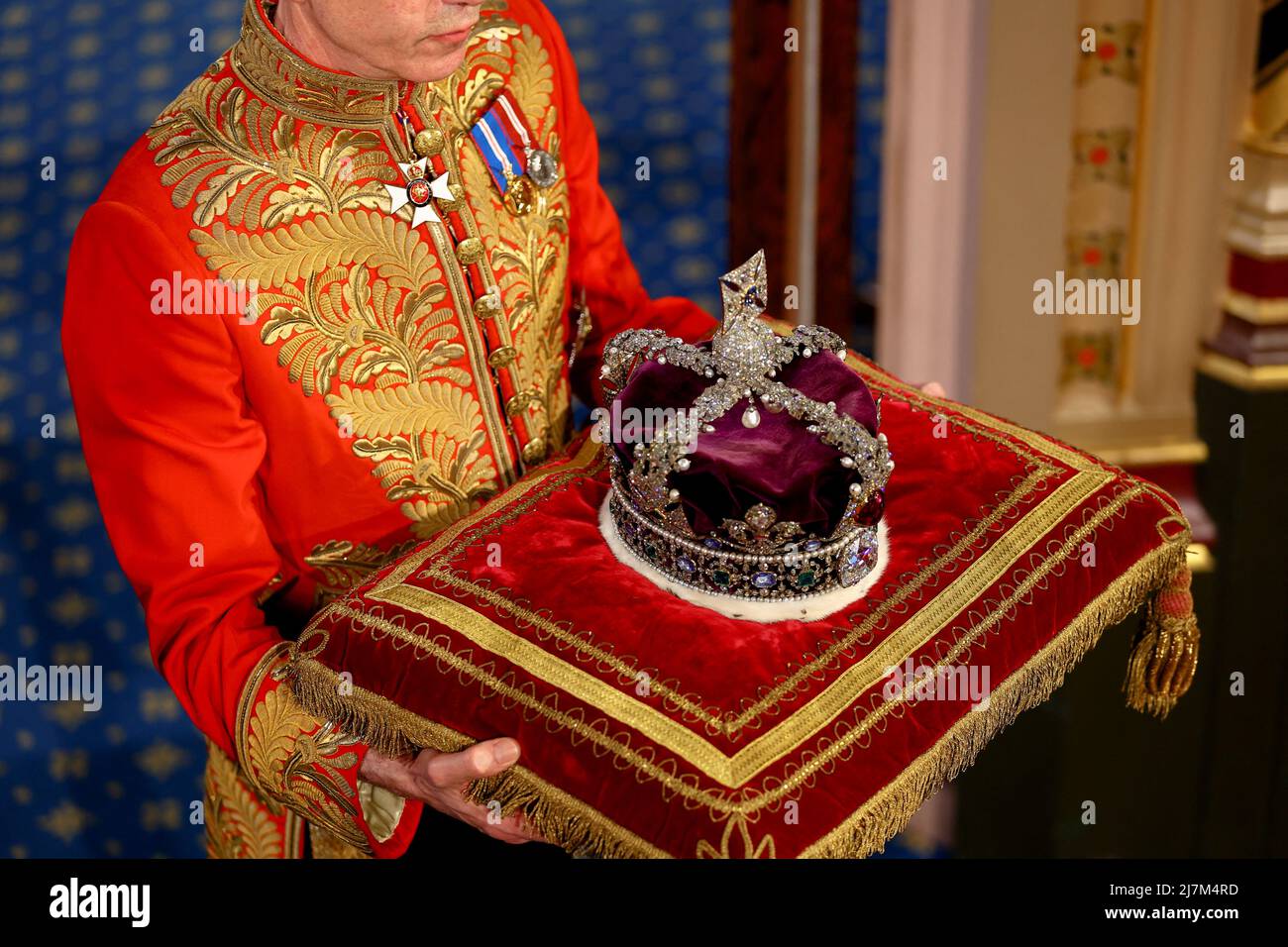 The Imperial State Crown is carried through the Royal Gallery after the ...