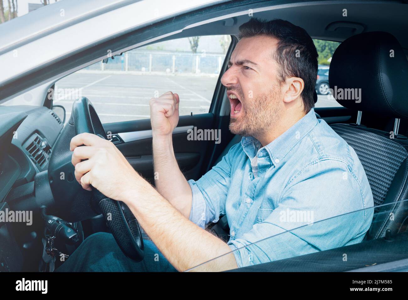 Angry and rude man driving his car feeling stressed Stock Photo Alamy