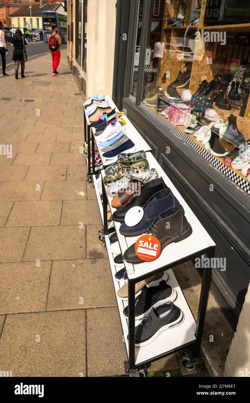 Exterior shoe shop in the centre of Norwich Norfolk showing the shoes