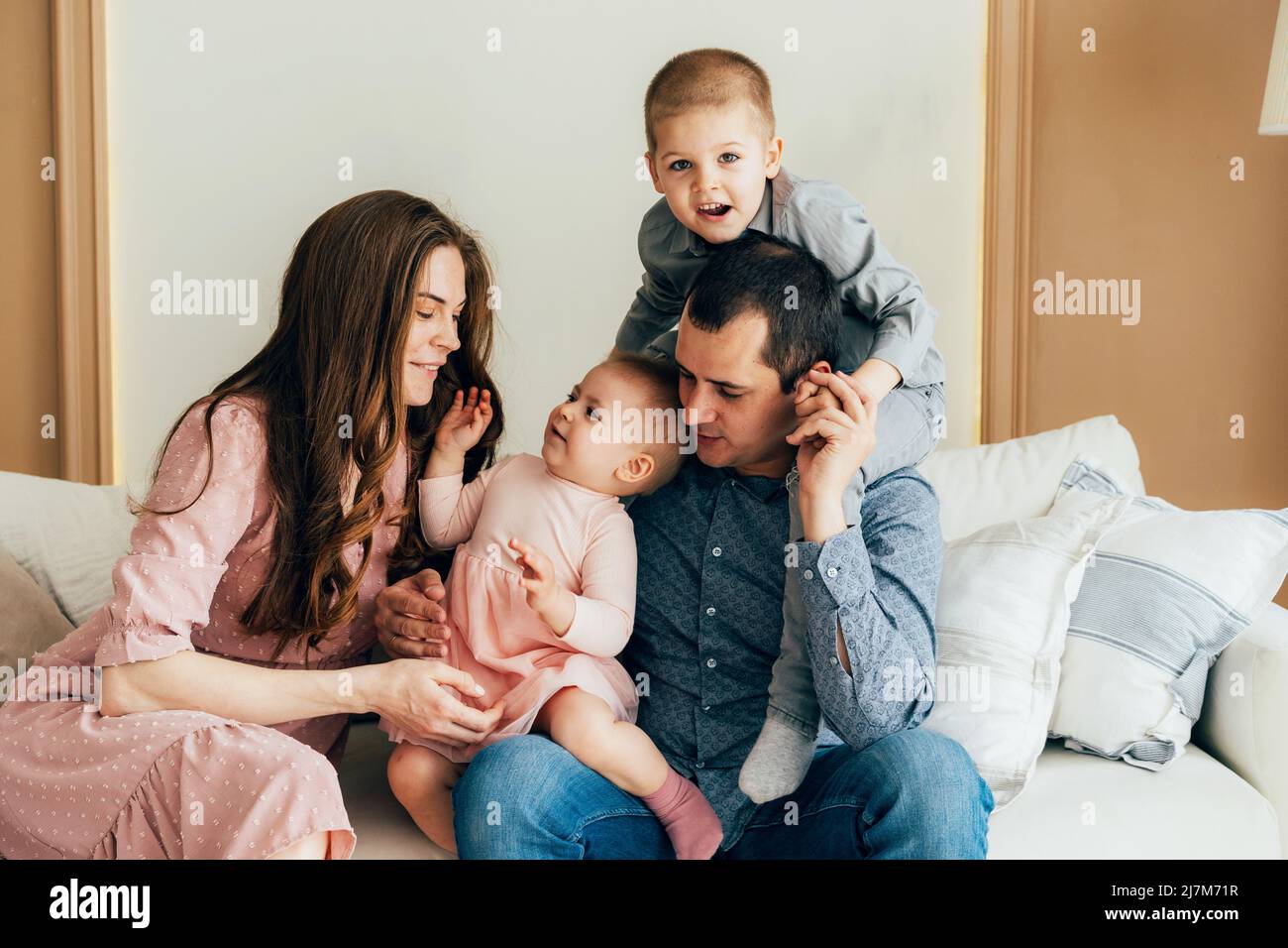 Family portrait of mom, dad, toddler daughter and preschooler son Stock ...