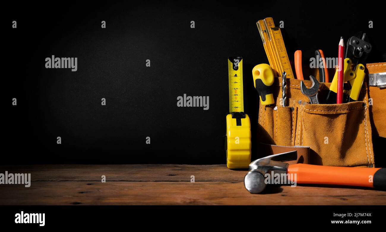 home improvement - construction tools on black background with copy space. banner Stock Photo
