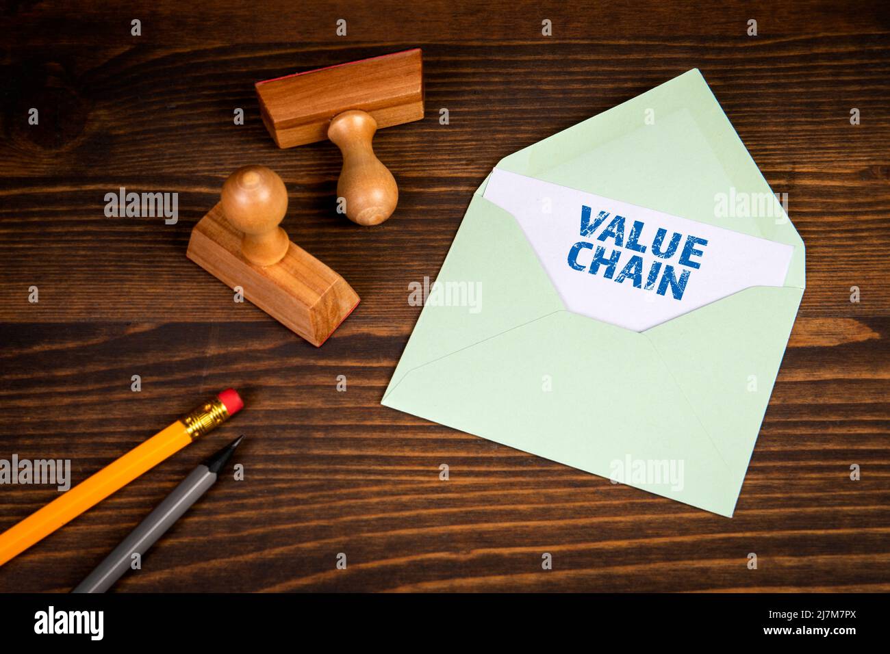 Value Chain. Letter and office supplies on a wooden background Stock