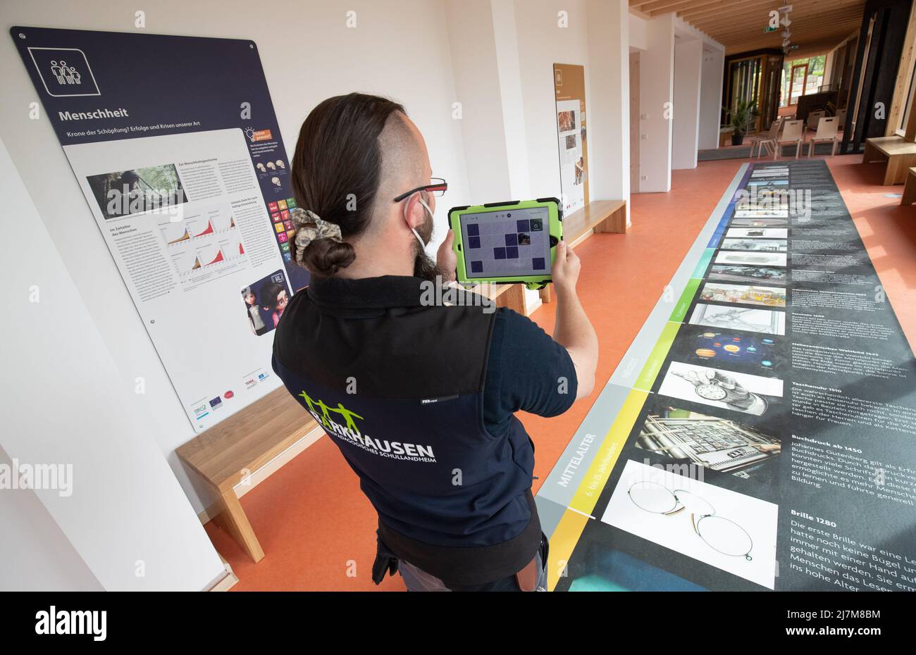Bad Essen, Germany. 10th May, 2022. Educational scientist Sascha Mordt  presents an augmented reality app with a tablet. The newly equipped  experiential education school camp Barkhausen presents a new interactive  nature experience