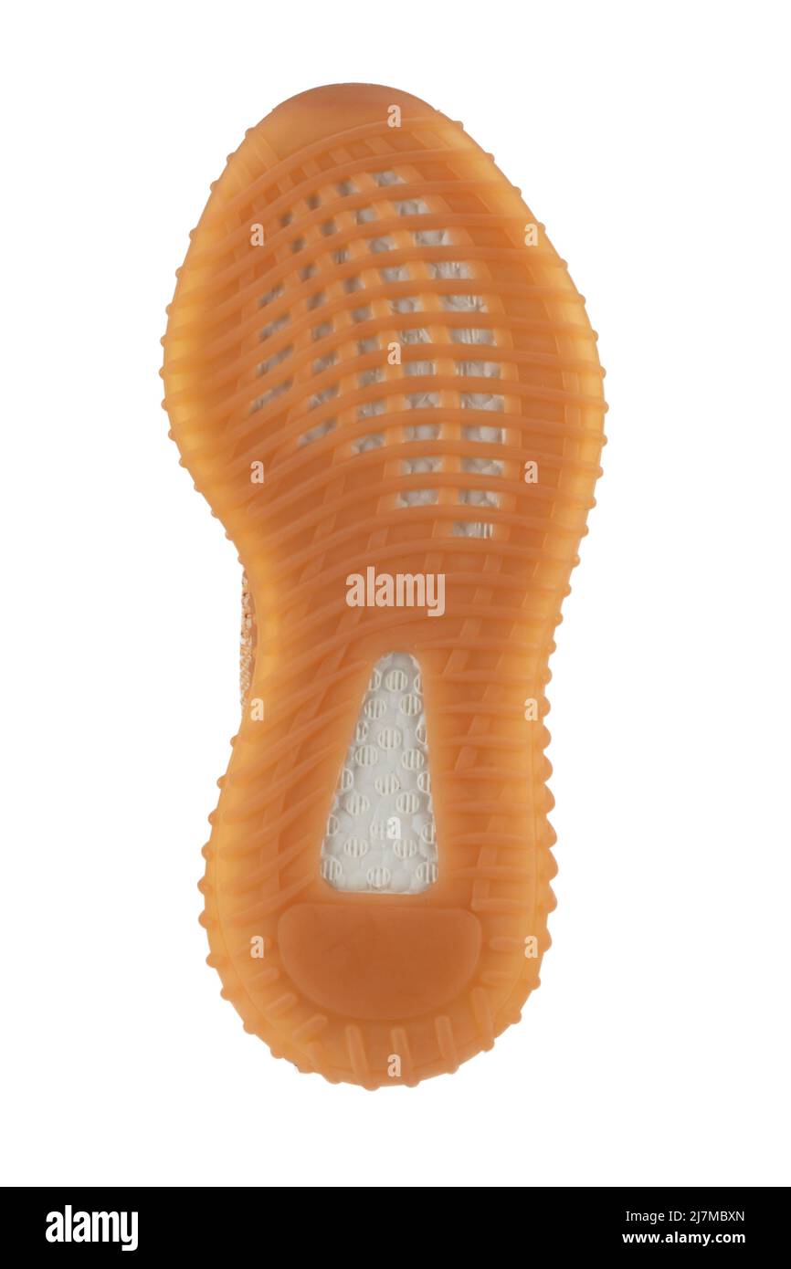 The polyurethane sole of the shoe is beige with white stripes Stock Photo Alamy