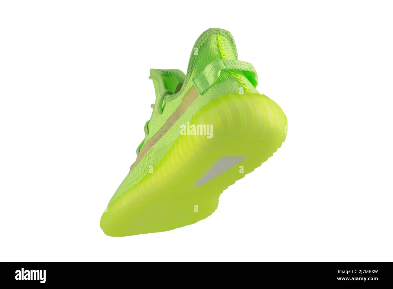 Green rag sneaker with a polyurethane sole on a white background. Stock Photo