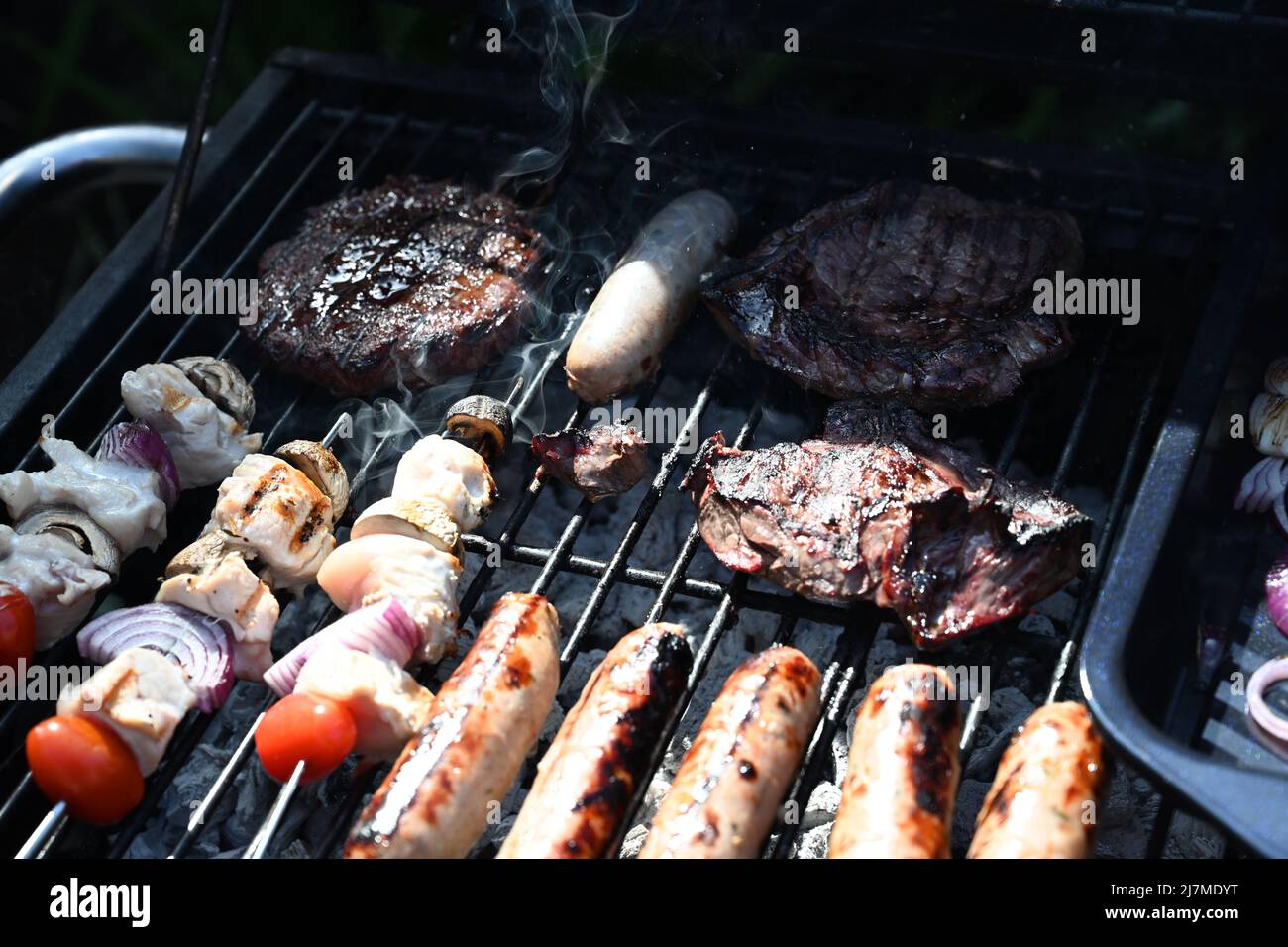 meat cooking on the barbecue Grill, outdoor living, garden party Stock Photo