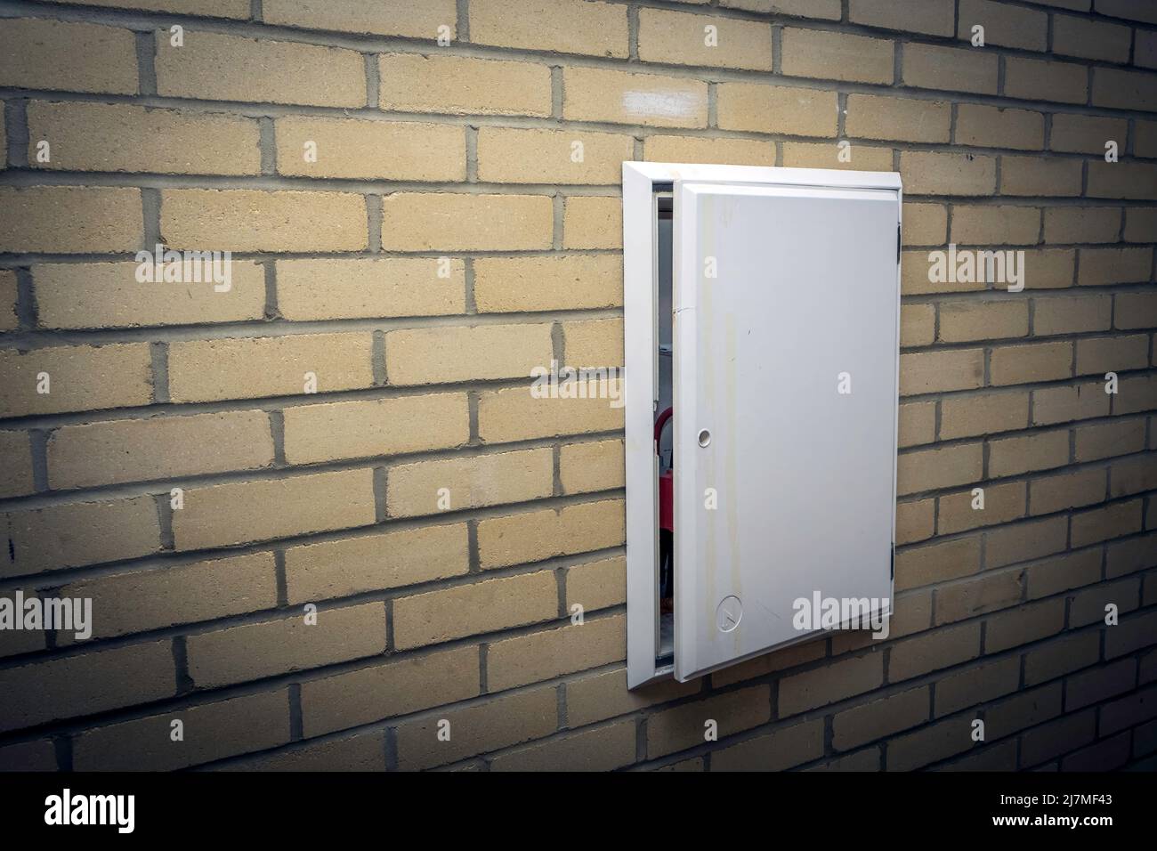 Little open door a gas and electric meter box Stock Photo