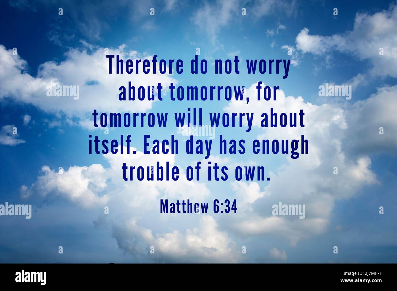 Quote from bible verse - Matthew 6:34 with bright sky and cloud background. Christianity and prayer concept Stock Photo