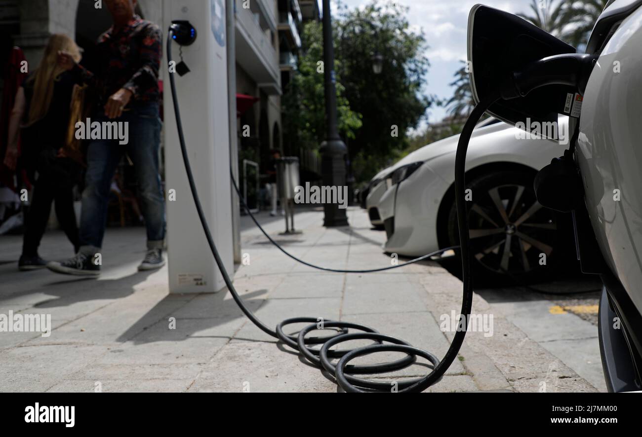 Palma, Spain. 09th May, 2022. An electric car is connected to a