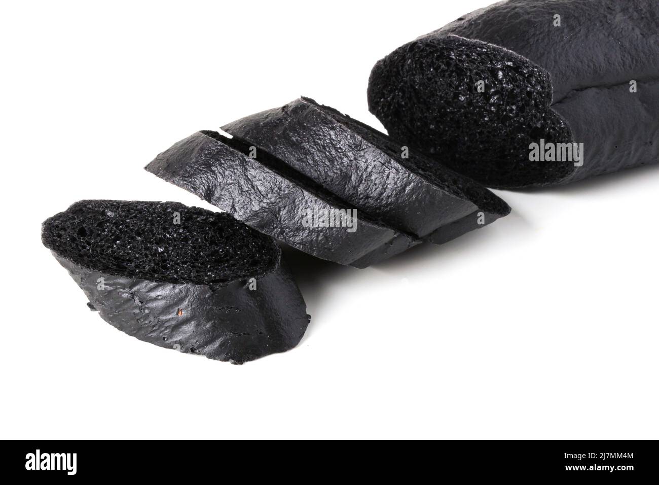 Sliced black bread baguette isolated on white Stock Photo