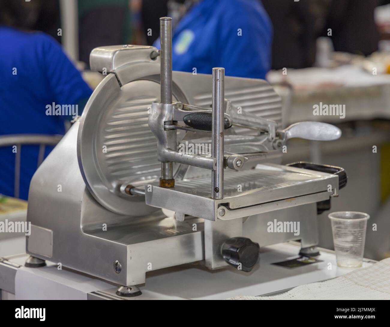 Professional Stainless Steel Deli Slicer Machine at Work Counter Stock