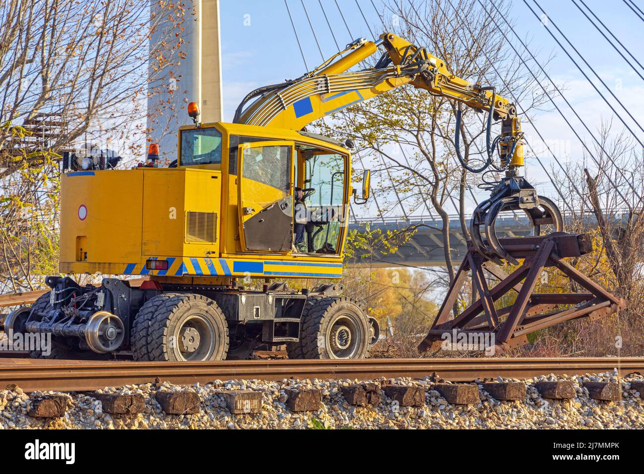 Removing Old Railroad Buffer Stop and Railway Tracks With Grappling Forks Digger Stock Photo
