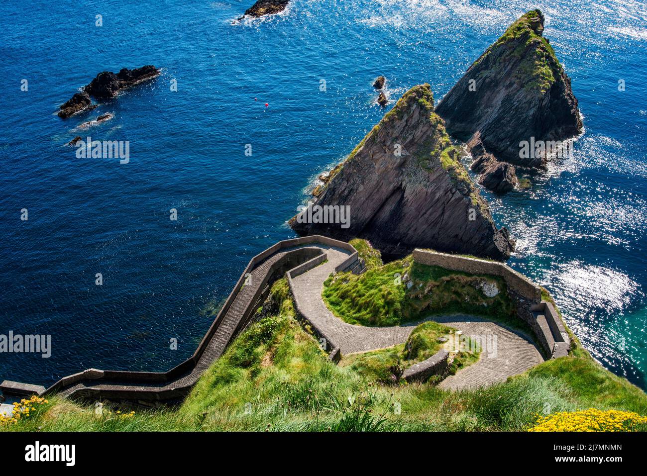 Rugged and steep winding coastal path leading up from Dunquin Harbour, Dingle, County Kerry, Ireland Stock Photo
