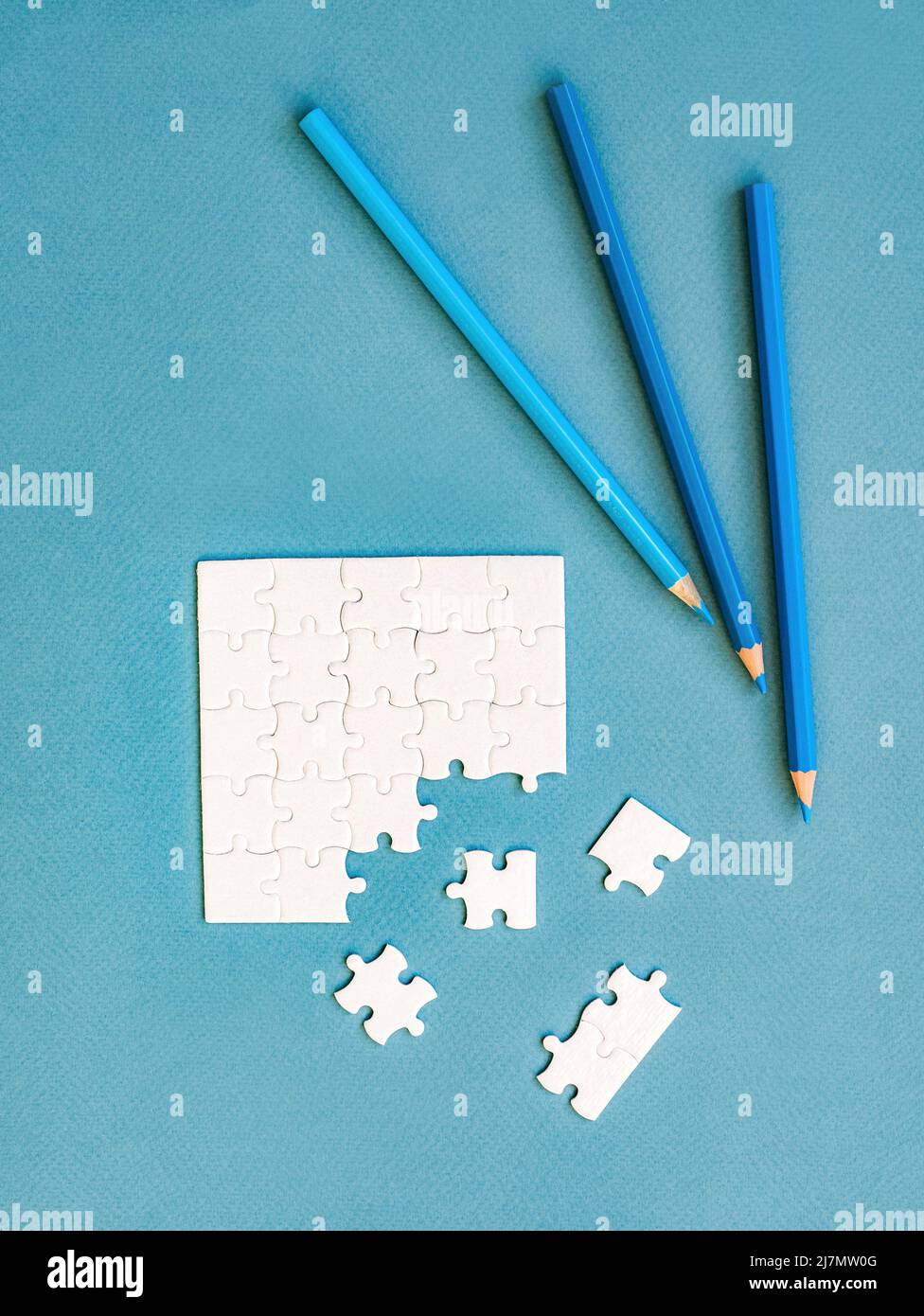 Small disassembled white square puzzle Stock Photo - Alamy