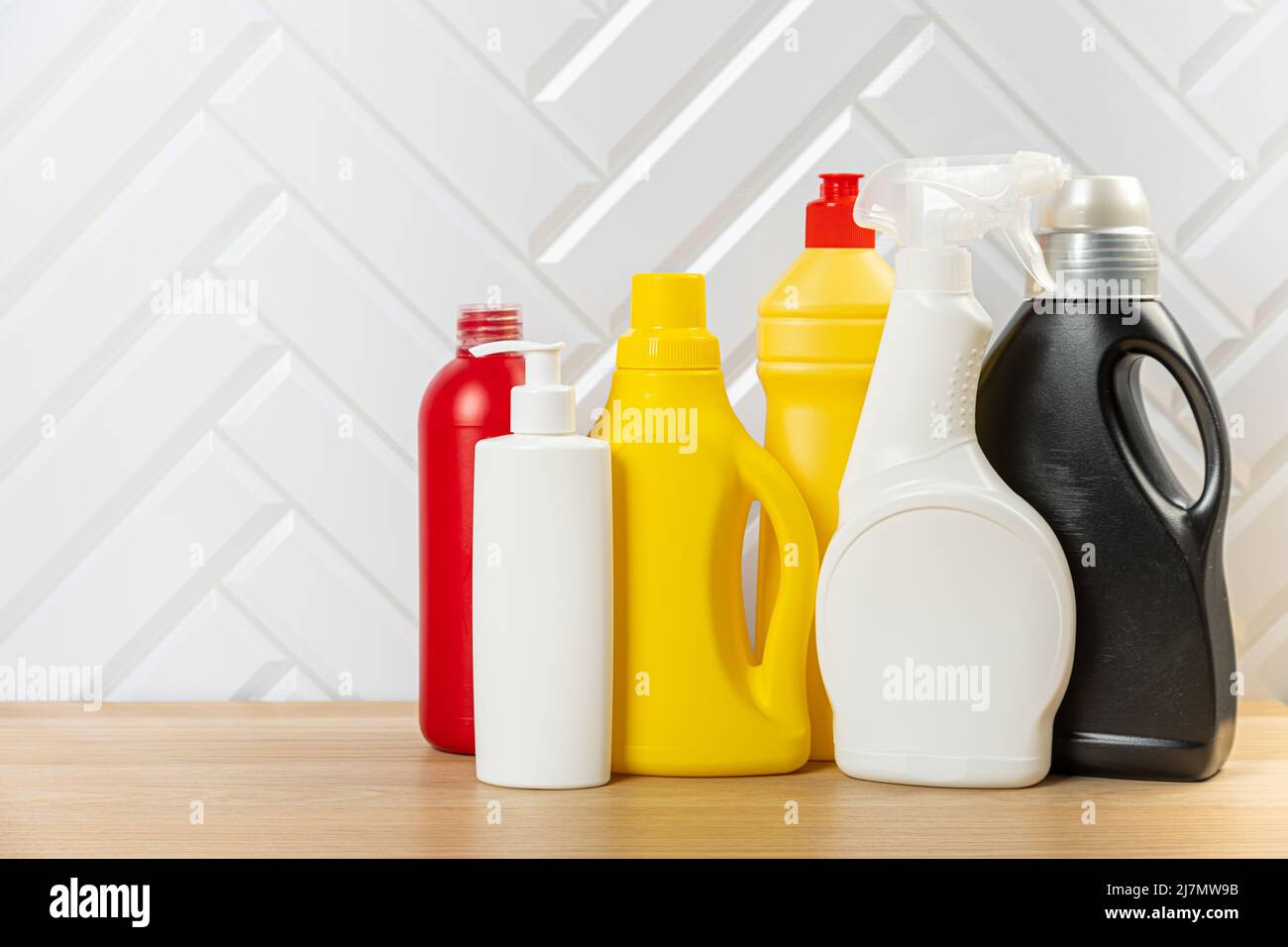 Cleaning bottles for different surfaces in kitchen, bathroom and other rooms. Spring regular cleanup. Set home cleaning products Stock Photo