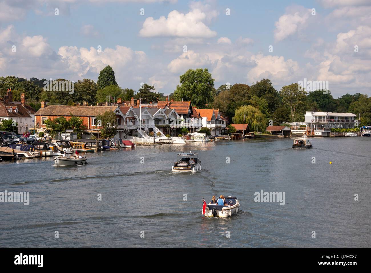 Boats moored by the riverside in Henley-on-Thames, Oxfordshire, UK Stock Photo