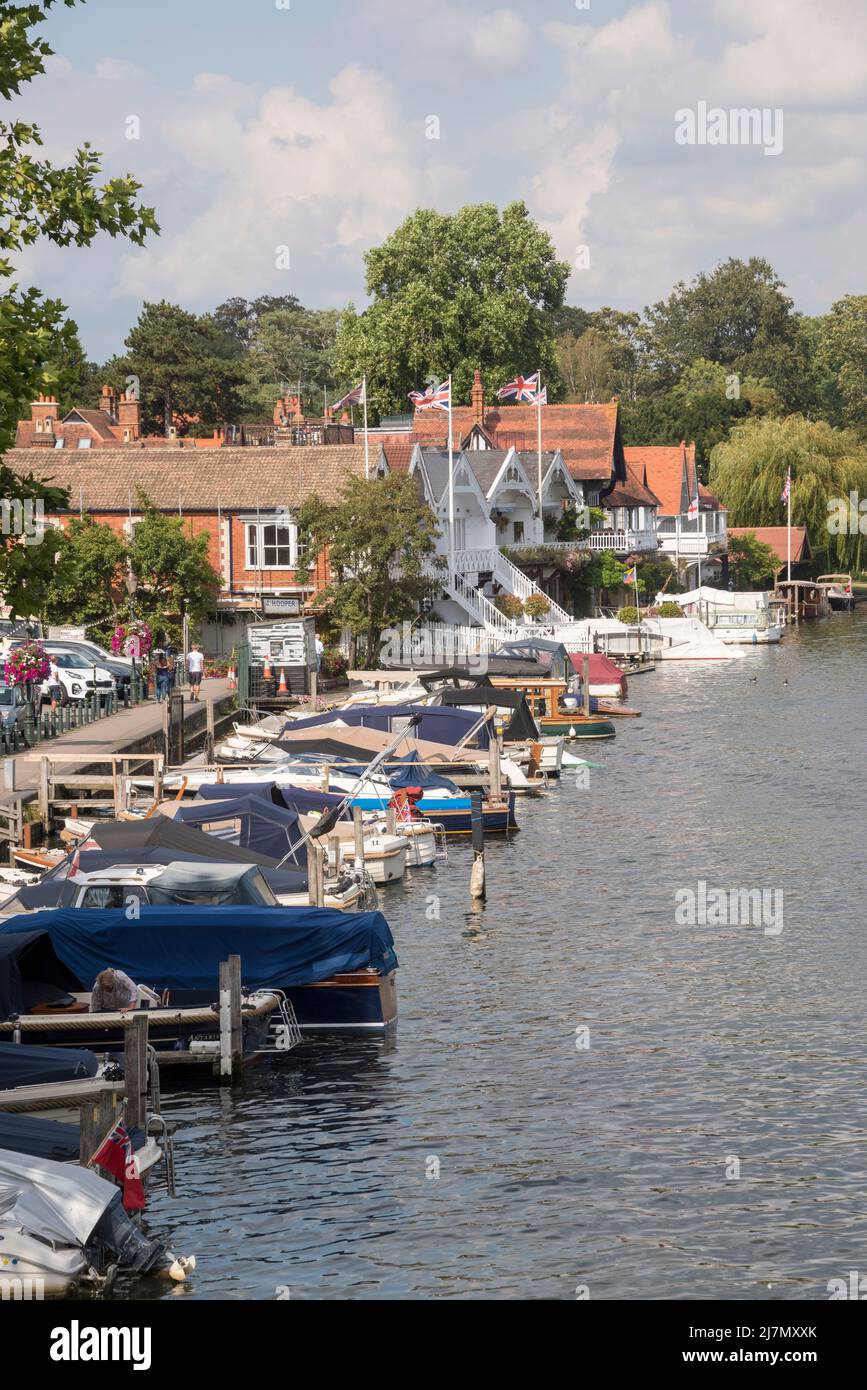Boats moored by the riverside in Henley-on-Thames, Oxfordshire, UK Stock Photo