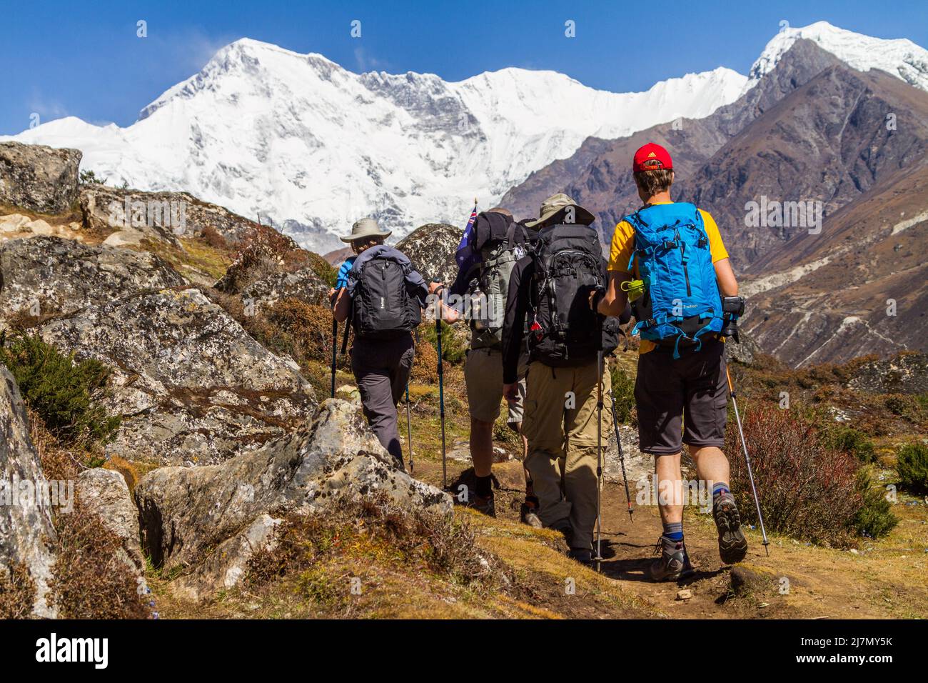 Men hiking on mountain - Nepal Stock Photo