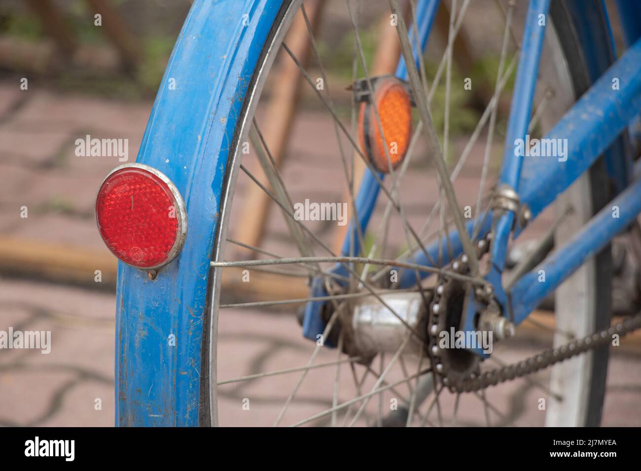 old blue bicycle stands in the yard close-up, retro bicycle Stock Photo