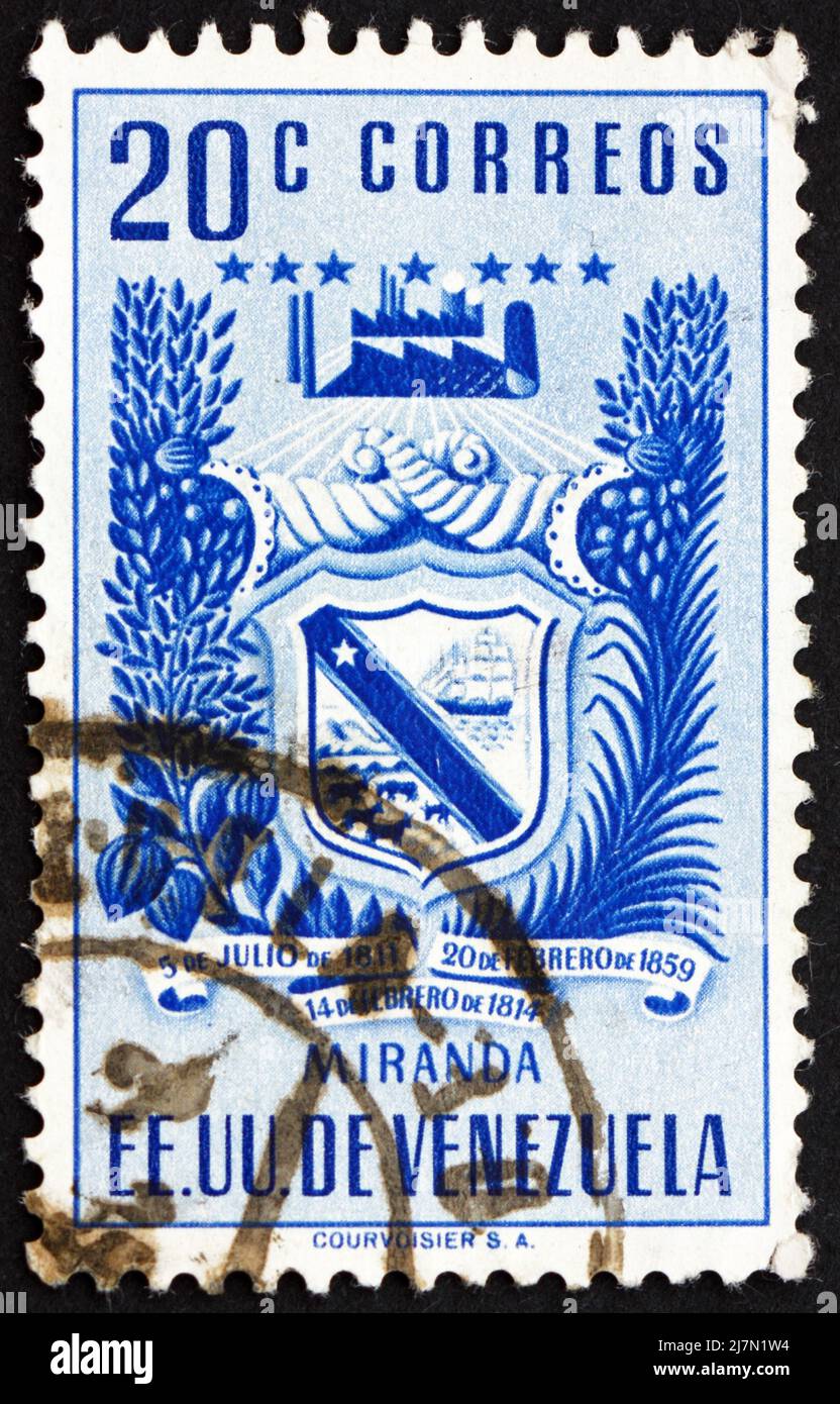 VENEZUELA - CIRCA 1952: a stamp printed in the Venezuela shows Arms of Miranda and Agricultural Products, Venezuela, circa 1952 Stock Photo