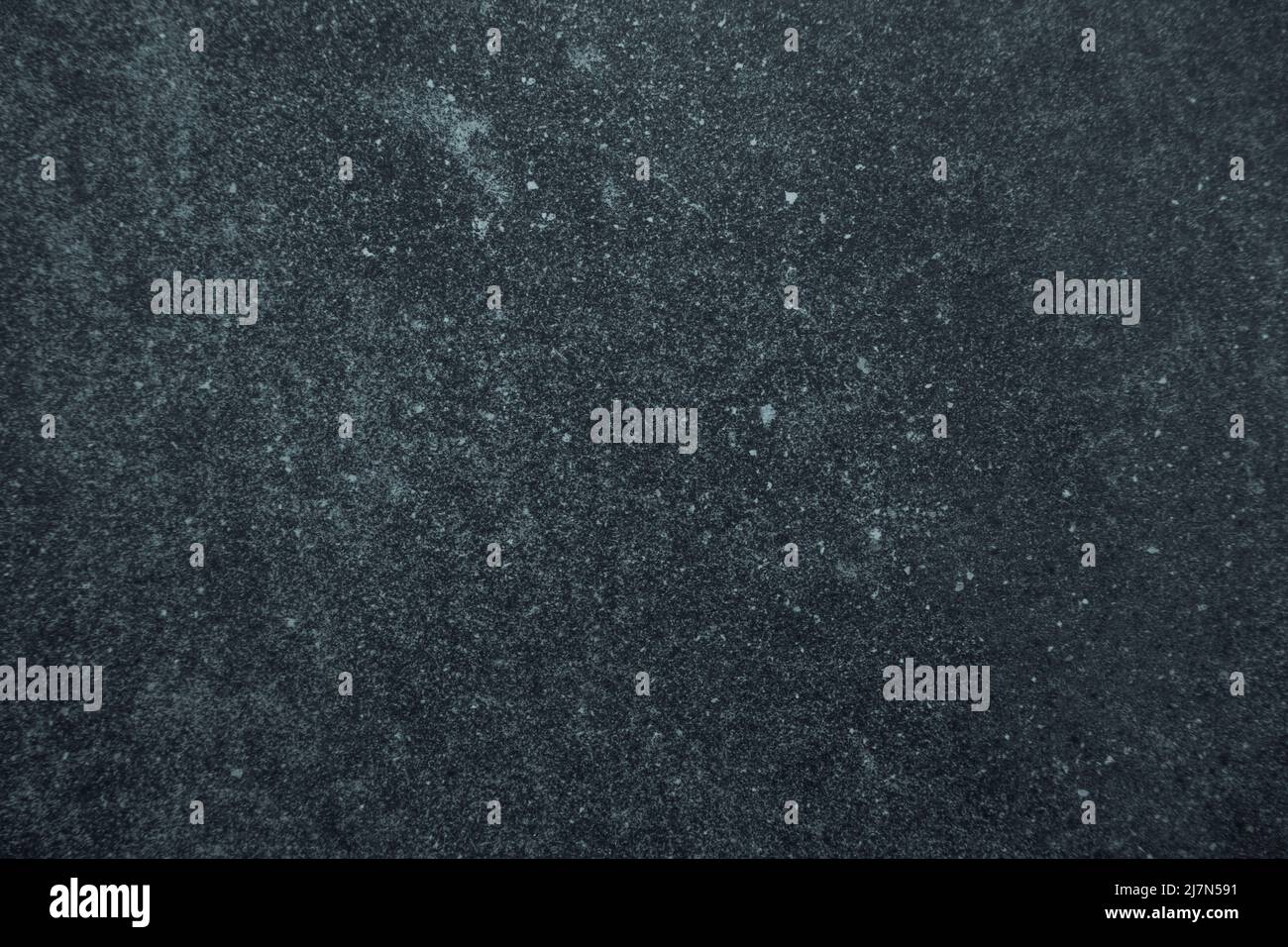 Dark worn blue and black stained surface background or texture Stock Photo