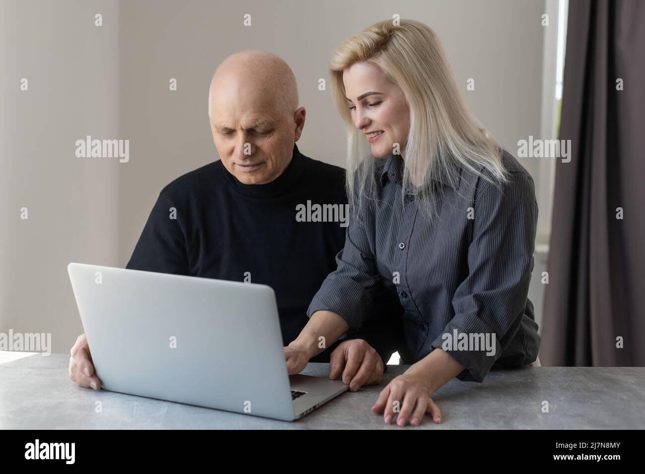 Front view happy elderly 70s grey haired man learning using computer ...