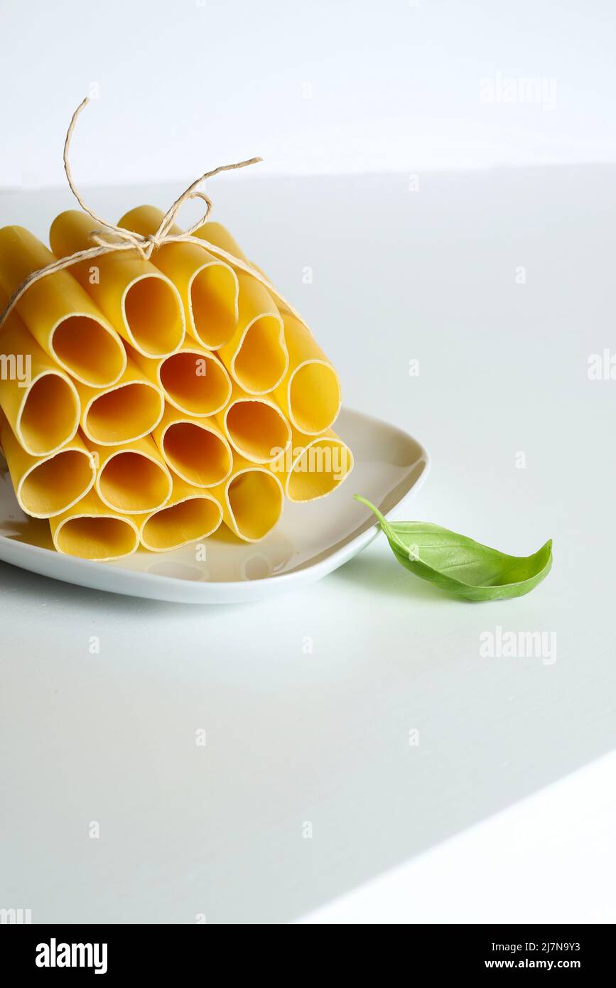 Cannelloni pasta tubes isolated on white background. Italian food. Stock Photo