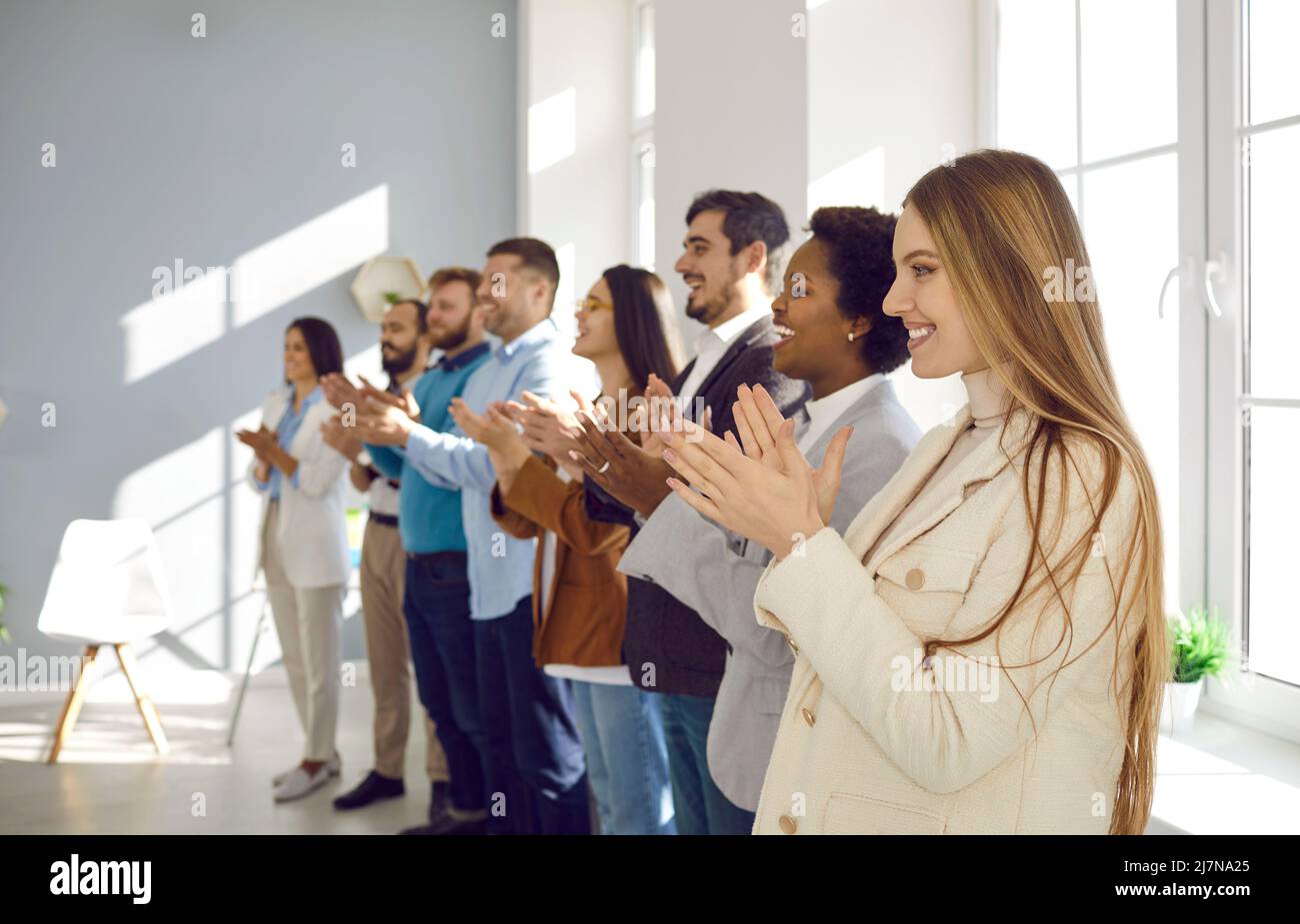 Multiracial group of business people clapping hands to congratulate their boss - Business company team, standing ovation after a successful meeting Stock Photo