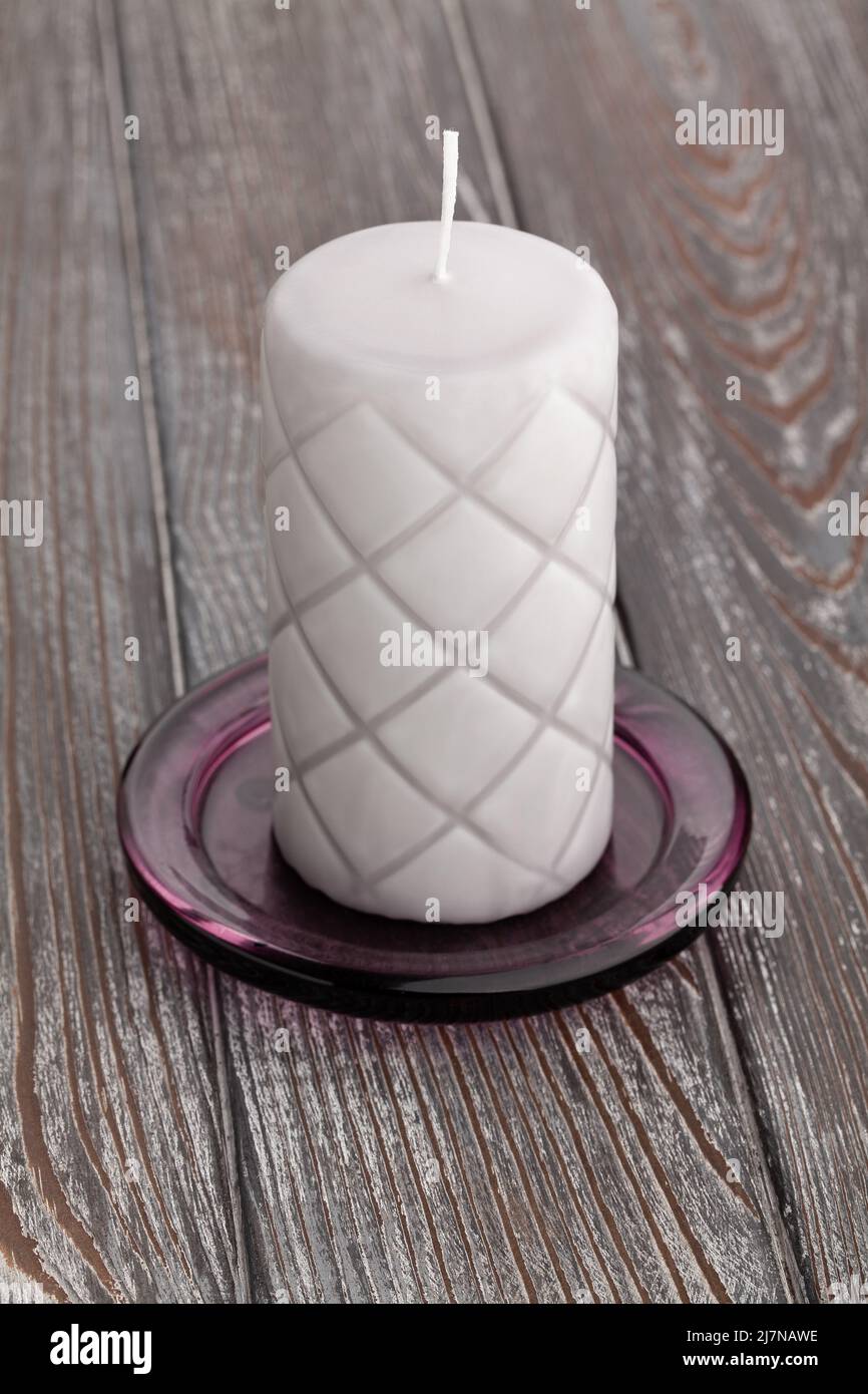 one candle on wood background Stock Photo