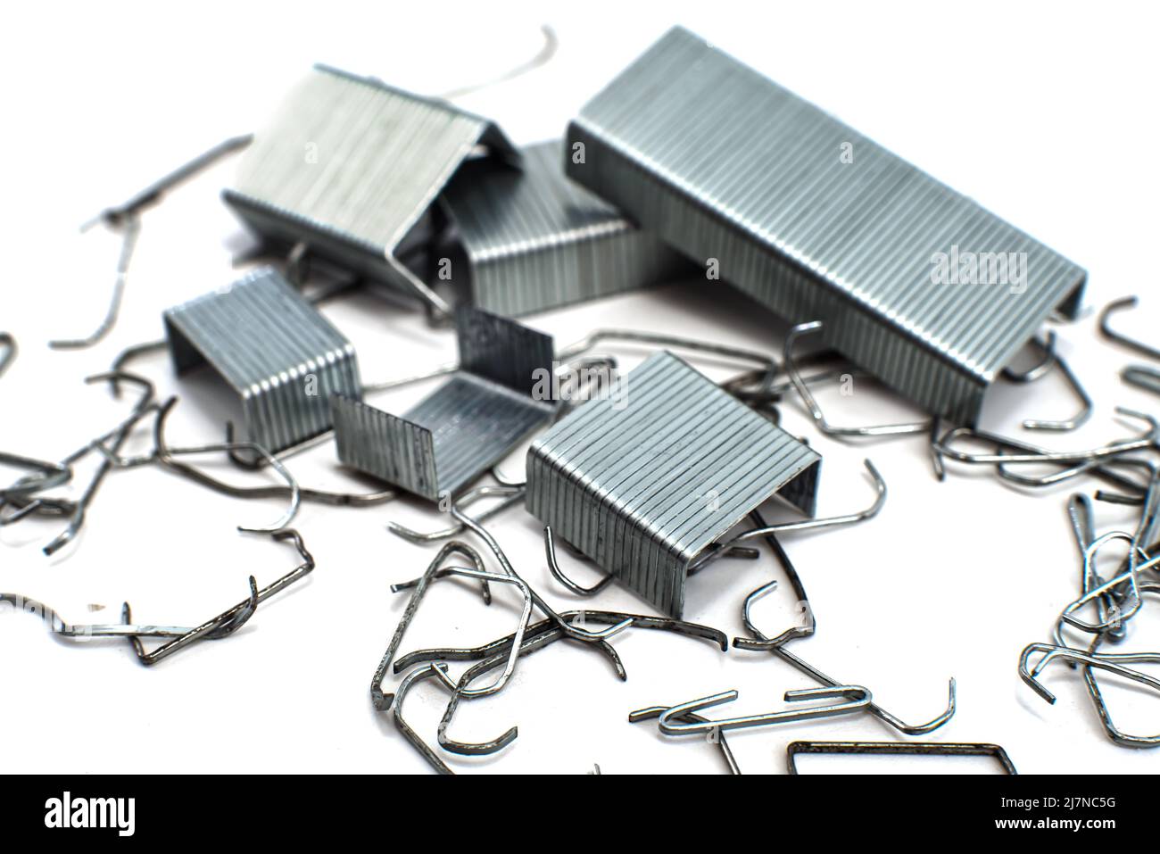 Staples from a stapler on a white background isolate of a bunch of