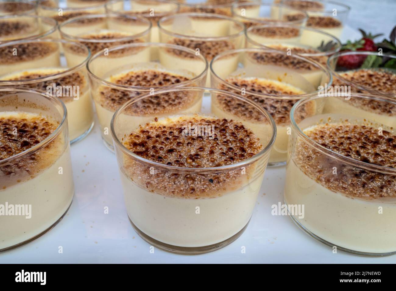 creme brulee in glass ramekins on party table Stock Photo Alamy