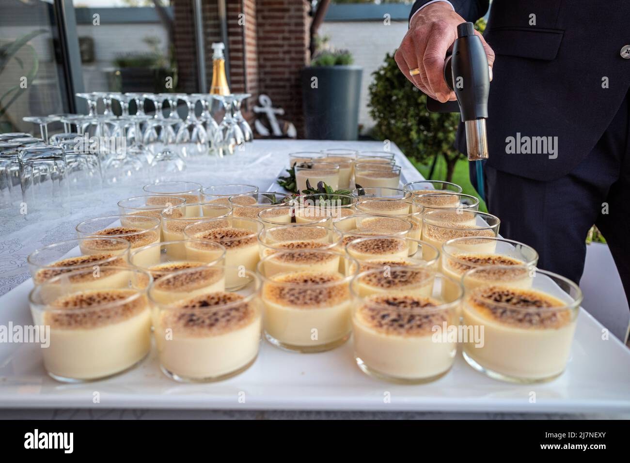 creme brulee in glass ramekins on party table Stock Photo Alamy