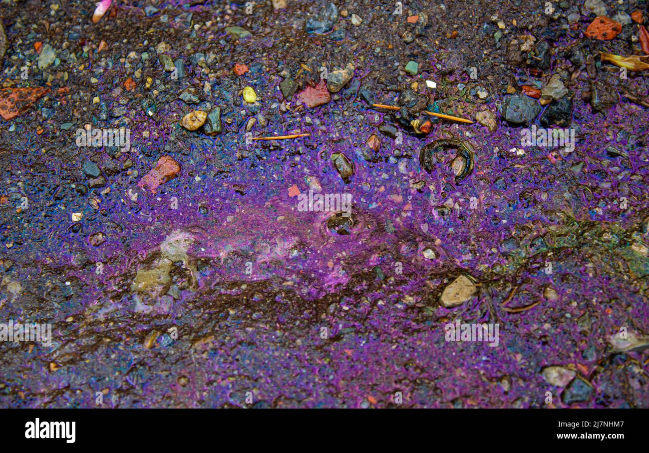 Neon purple background. Chemical stain on concrete. Toxic chemicals