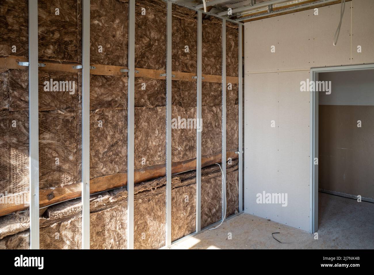 Insulation wool was installed behind a drywall Stock Photo Alamy