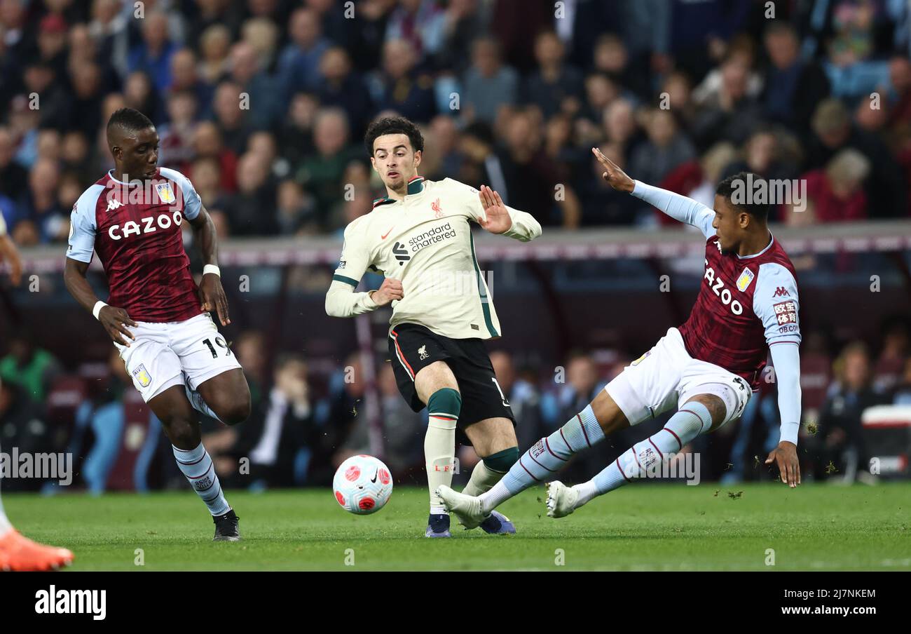 Birmingham, England, 10th May 2022.   Curtis Jones of Liverpool is tackled by Ezri Konsa of Aston Villa during the Premier League match at Villa Park, Birmingham. Picture credit should read: Darren Staples / Sportimage Stock Photo