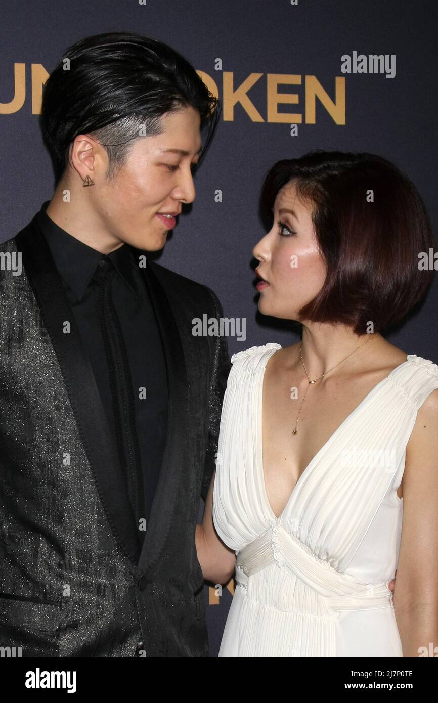 LOS ANGELES - DEC 15:  Takamasa Ishihara, Miyavi, Melody Ishihara at the 'Unbroken' - Los Angeles Premiere at the Dolby Theater on December 15, 2014 in Los Angeles, CA Stock Photo