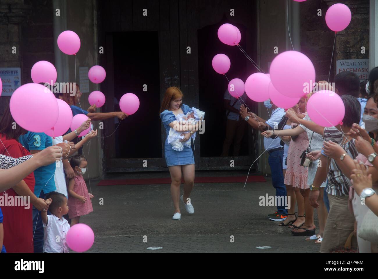 Catholic religious christening ceremony, Jaro Metropolitan Cathedral, IloIlo, Philippines Stock