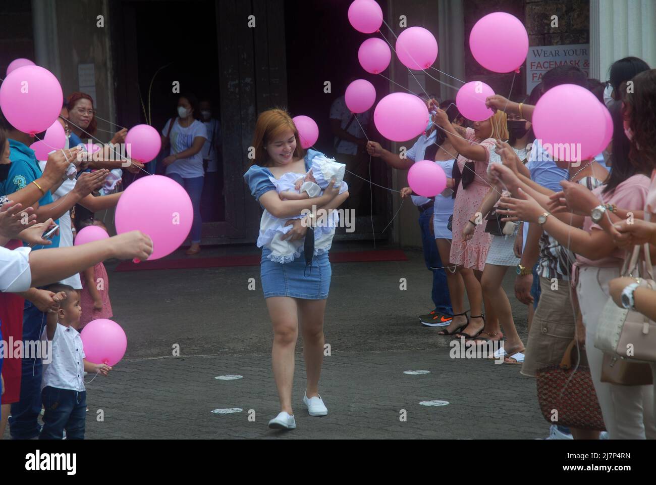 Catholic religious christening ceremony, Jaro Metropolitan Cathedral, IloIlo, Philippines Stock