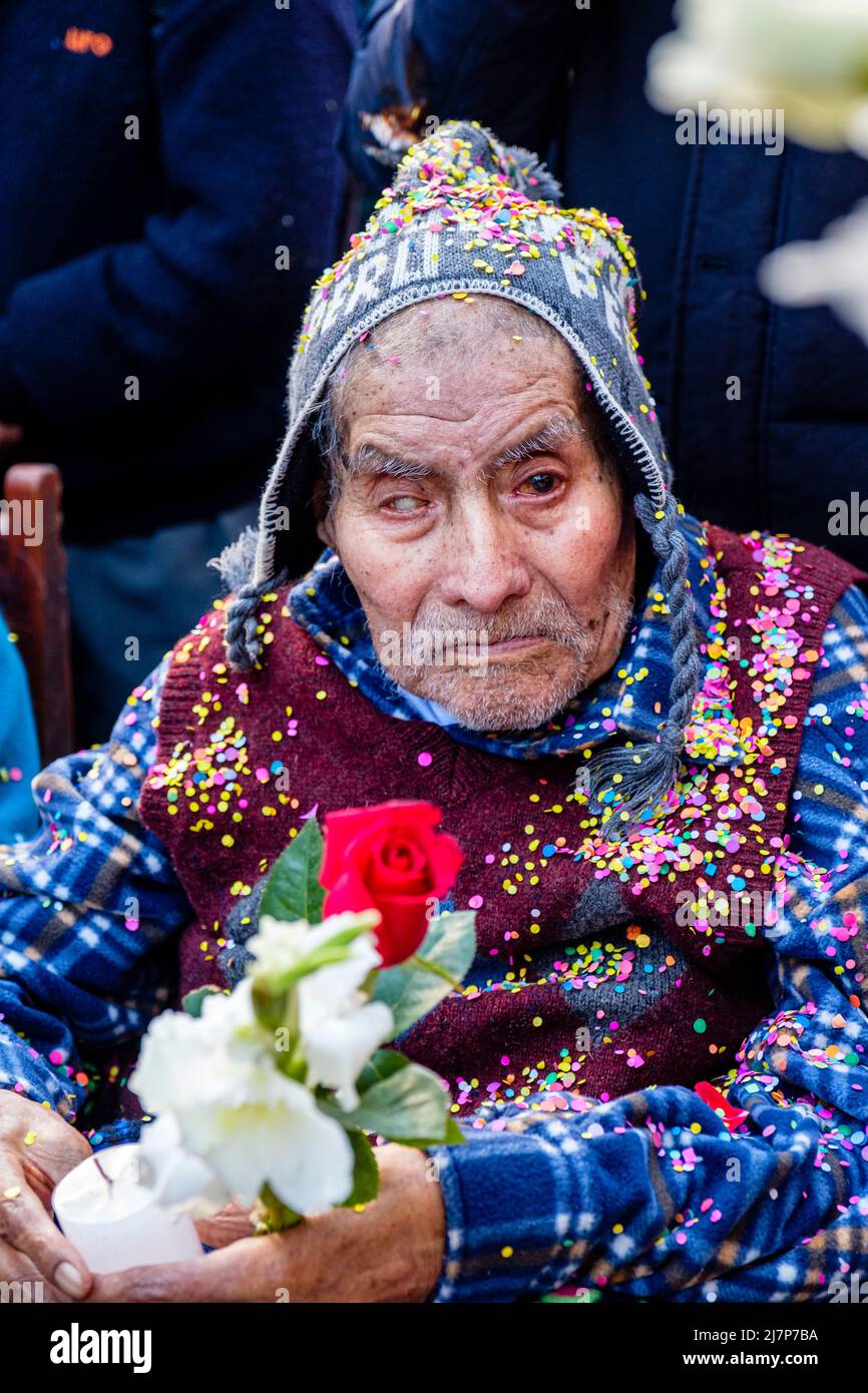 Senior Peruvian man, devotee at a religious festival in Ollantaytambo, Urubamba Valley, Peru Stock Photo