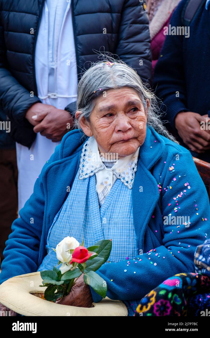 Peru women, Latin American elderly people senior Peruvian woman, devotee at a religious festival in Ollantaytambo, Urubamba Valley, Peru Stock Photo