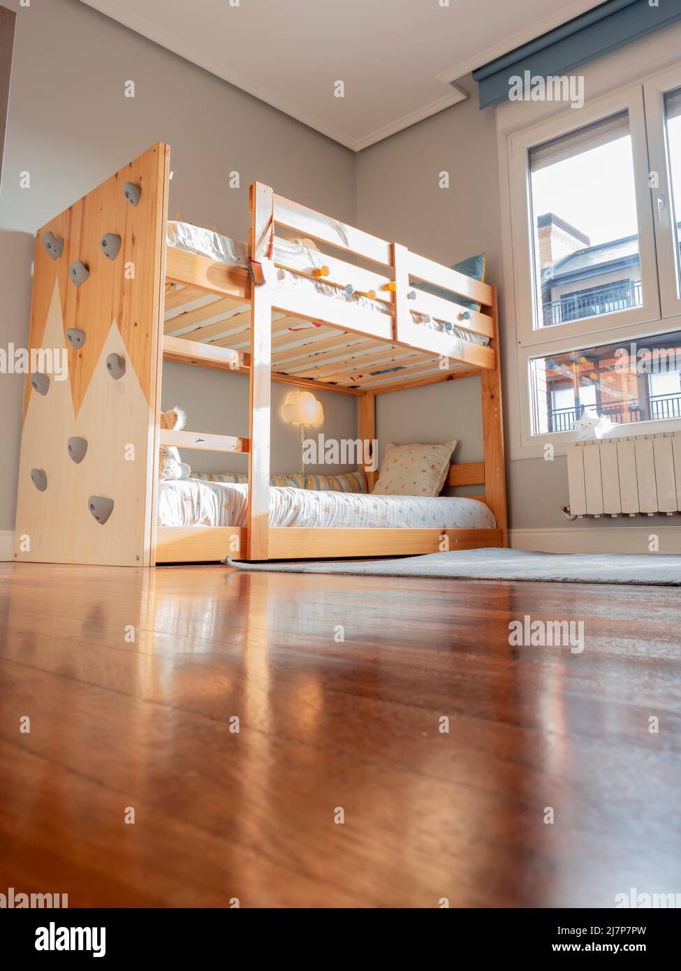 Montessori children's room with bunk bed and climbing wall Stock Photo -  Alamy