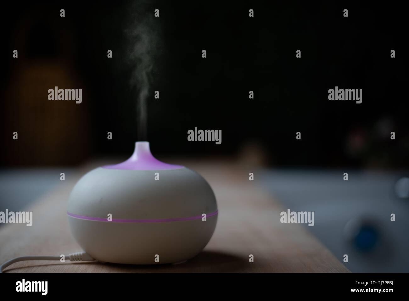 essential oil diffuser. electric aromatherapy device. steam against