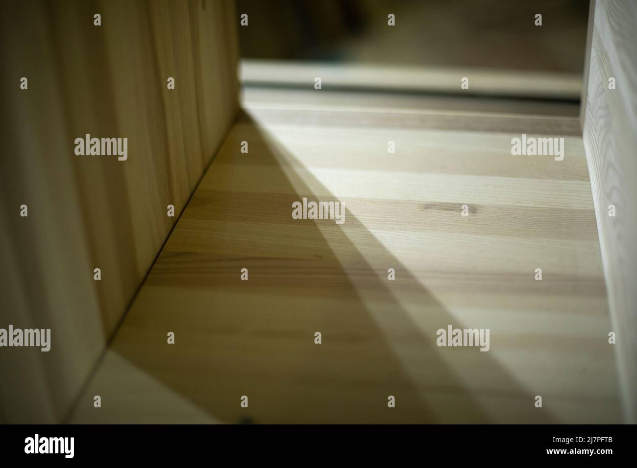 Boards on table. Furniture details. Blanks made of wood. Details of