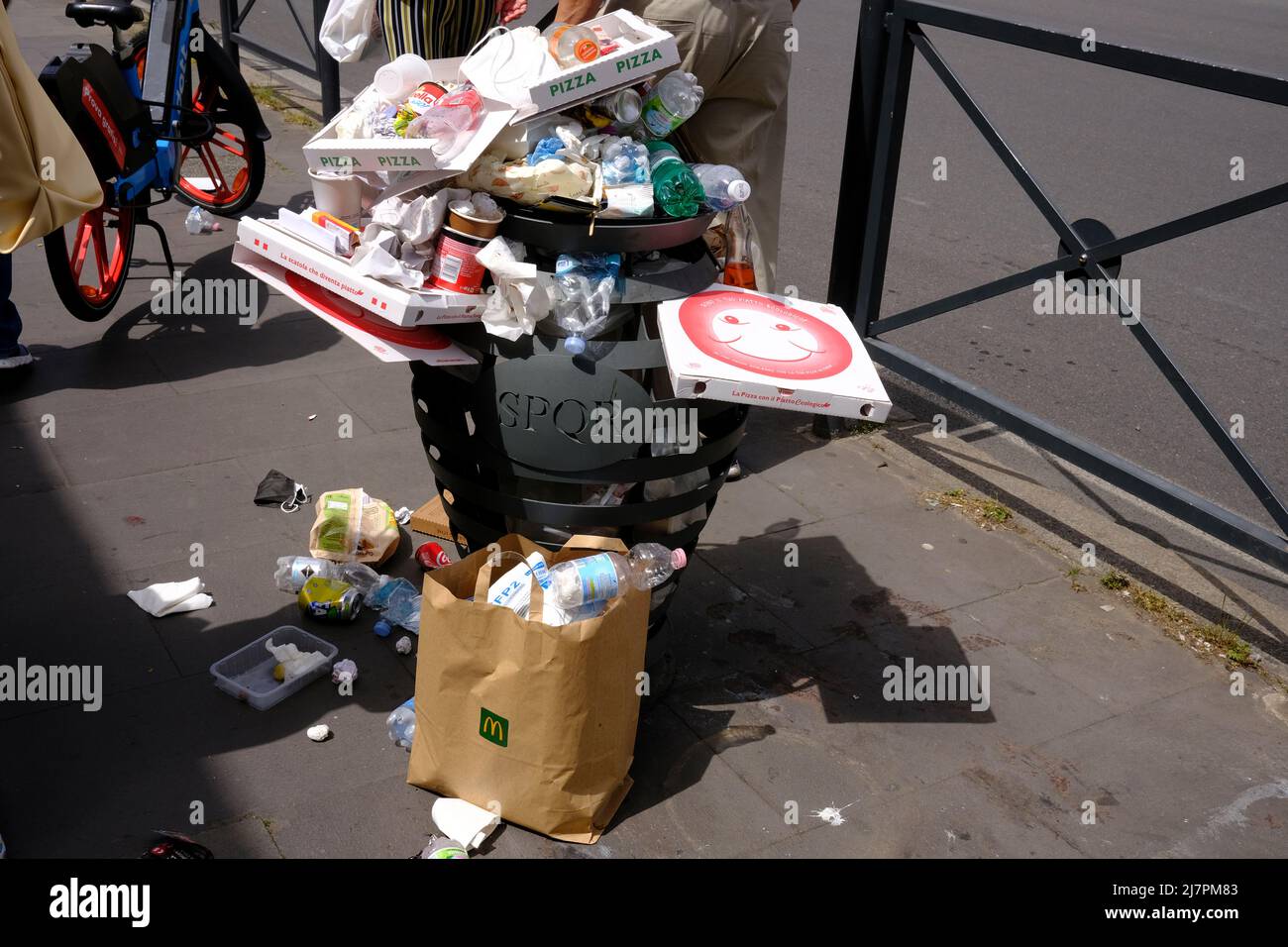 Overflowing Garbage Can on the street in Rome, Italy Stock Photo