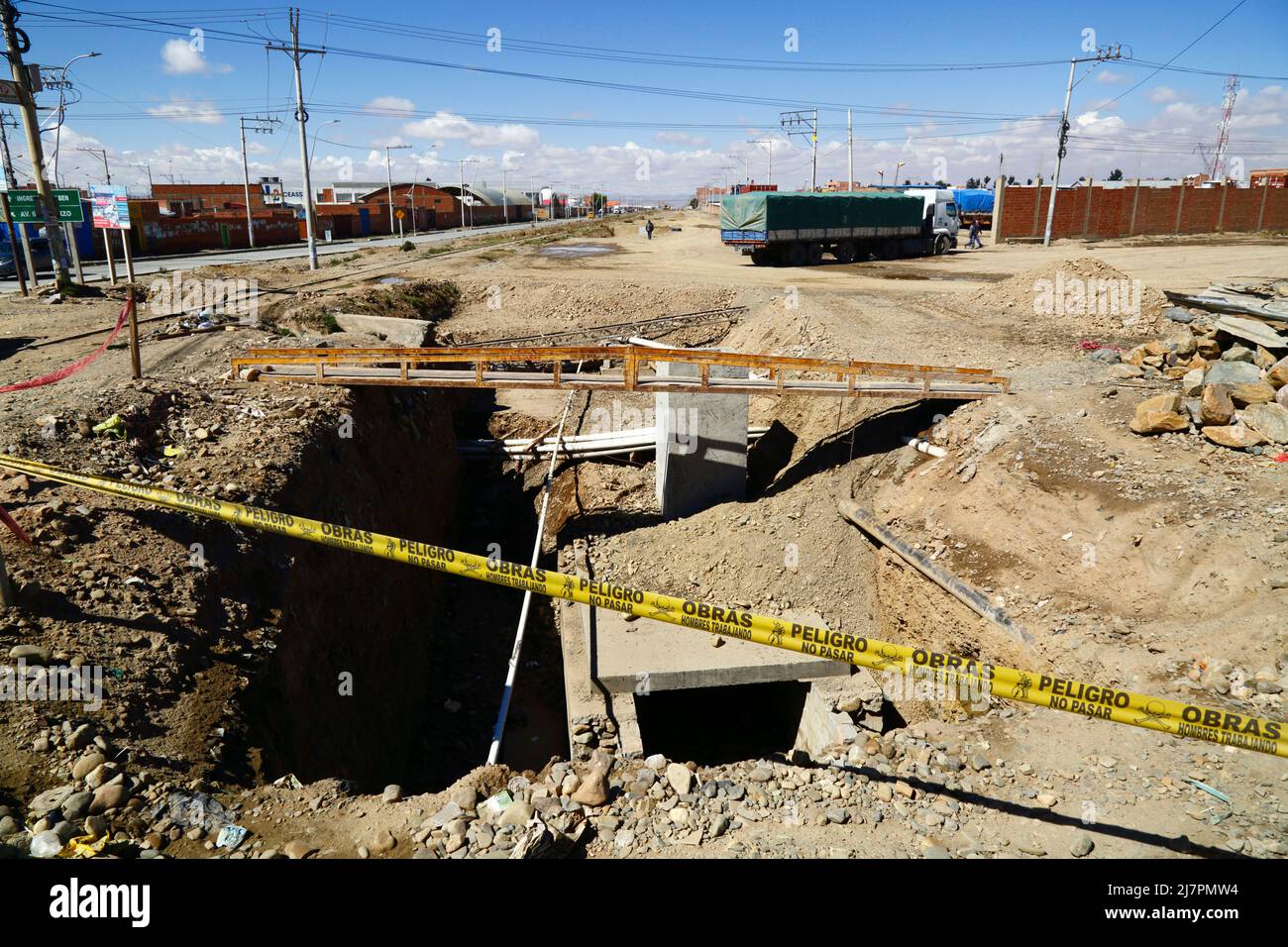 Unfinished installation of new underground drainage system next to main highway in Senkata district, El Alto, Bolivia Stock Photo