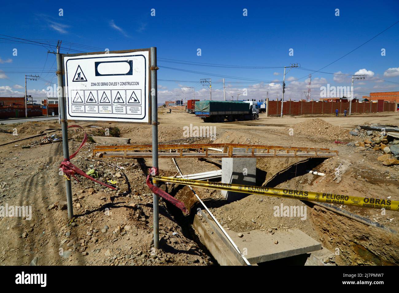 Unfinished installation of new underground drainage system next to main highway in Senkata district, El Alto, Bolivia Stock Photo