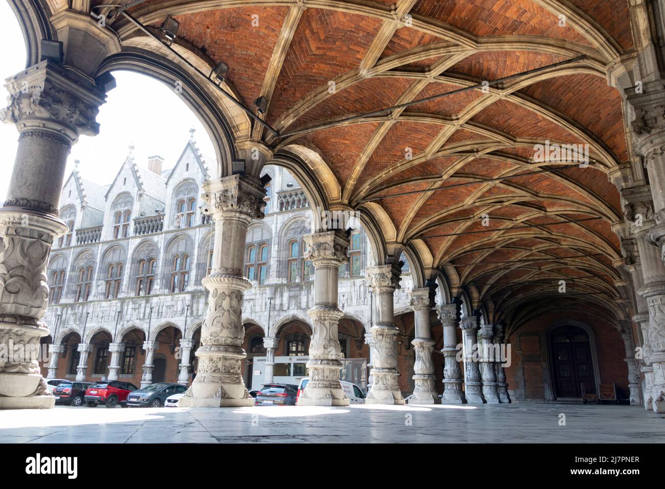 Cloister arches in courtyard of Prince-Bishops' Palace (Palais des Princes-Evêques) at Place Saint-Lambert Stock Photo