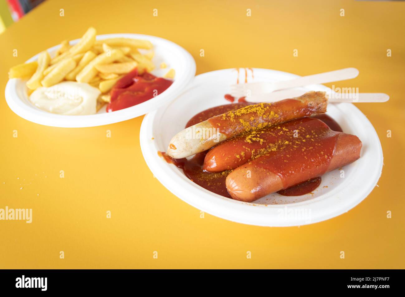 German currywurst  and bockwurst (weisswurst) served with frites (fries) Stock Photo