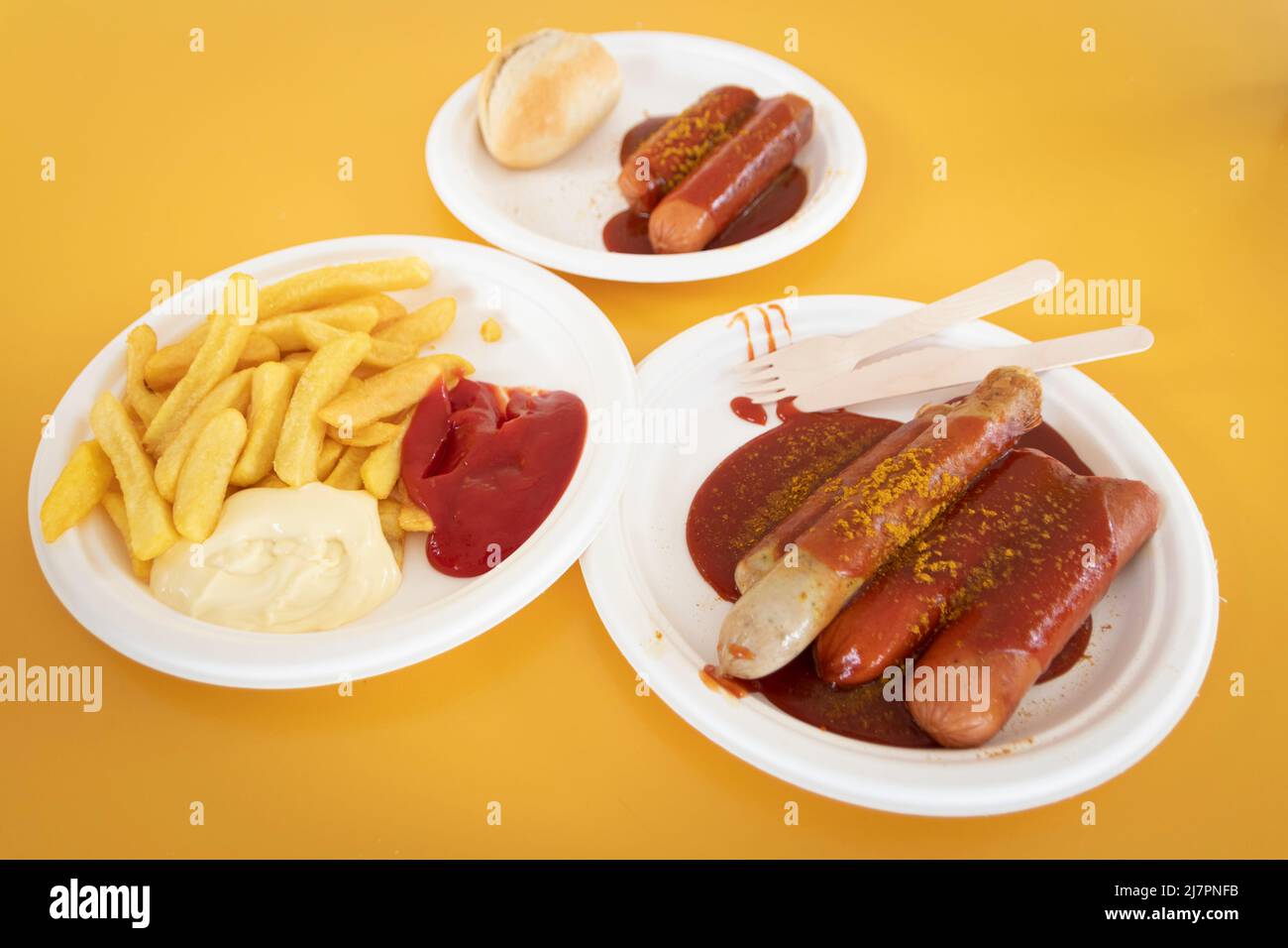 German currywurst  and bockwurst (weisswurst) served with frites (fries) Stock Photo